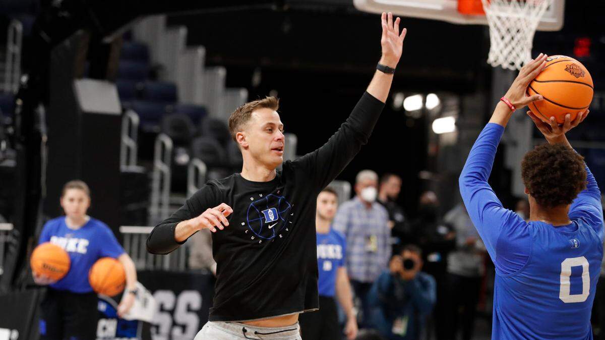 Duke associate head coach Jon Scheyer defends as Wendell Moore Jr. shoots during the Blue Devils’ practice at the Chase Center in San Francisco, Calif. Wednesday, March 23, 2022. Duke plays Texas Tech in the Sweet 16 Thursday.