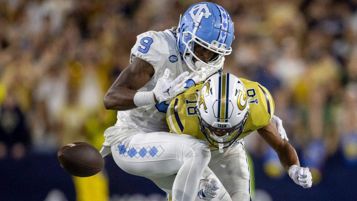 Georgia Tech’s Ahmari Harvey (18) collides with North Carolina’s Devontez Walker (9), forcing a fumble, after a 36-yard pass completion from quarterback Drake Maye with 2:54 to play in the game, securing a 46-42 victory for the Yellow Jackets on Saturday, October 28, 2023 at Bobby Dodd Stadium in Atlanta, Georgia.