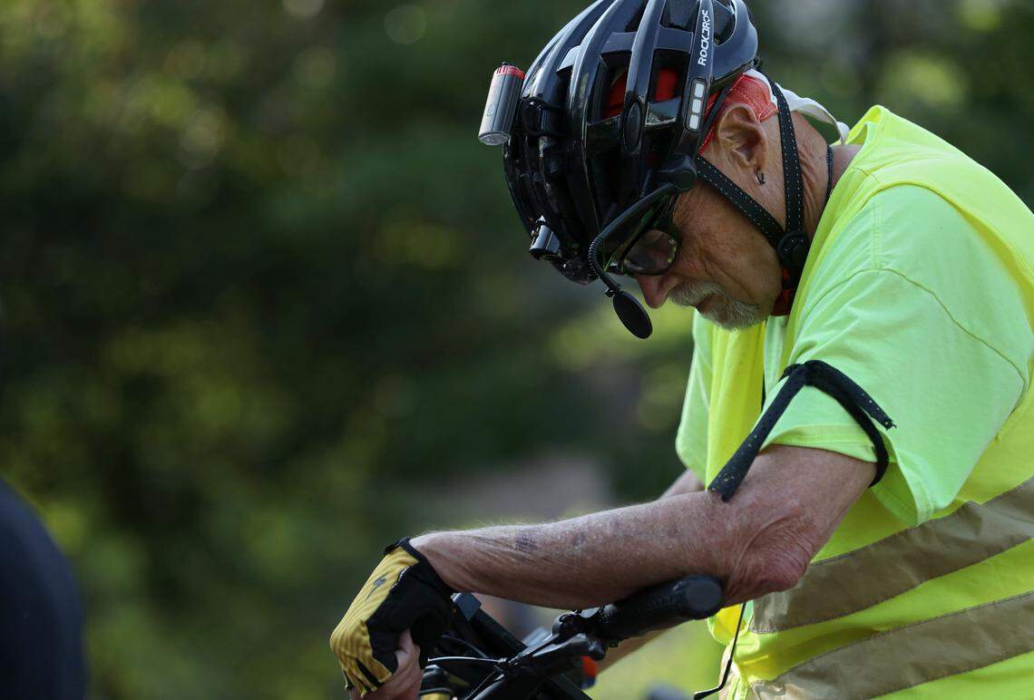 John Reives listens to remarks prior to the Ride of Silence, an event to remember those killed or injured while biking, on Wednesday, May 17, 2023, in Durham, N.C.