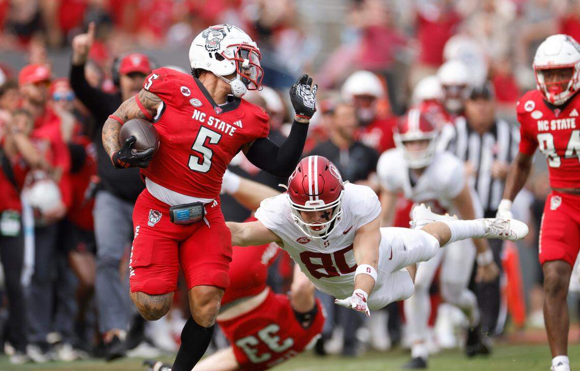 N.C. State’s DK Kaufman (5) beats Stanford’s David Kasemervisz (80) on a 91-yard kickoff return during the second half of N.C. State’s 59-28 victory over Stanford at Carter-Finley Stadium in Raleigh, N.C., Saturday, Nov. 2, 2024.