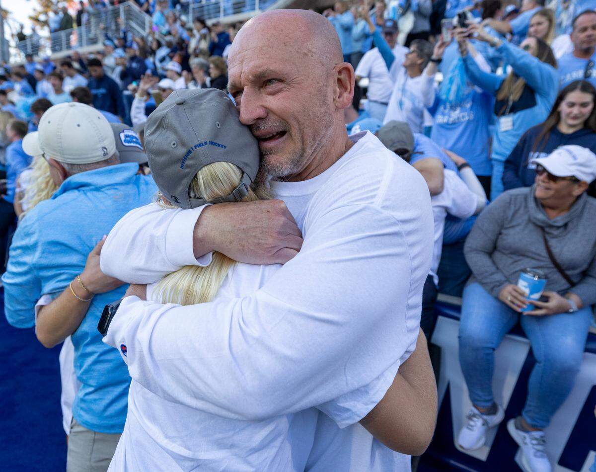 Roy Heck embraces his daughter Ryleigh Heck (12) after she scored the game winning goal in the NCAA Division I Field Hockey Championship on Sunday, November 19, 2023 at Karen Shelton Stadium in Chapel Hill, N.C. This is North Carolina’s fifth national title in six years.