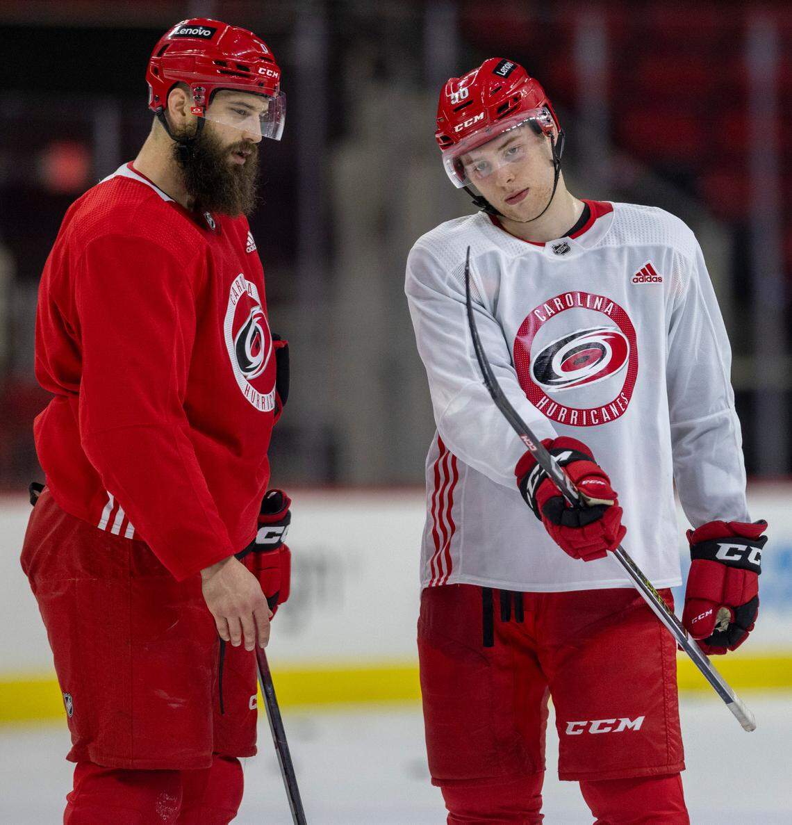 Carolina Hurricanes defenseman Brent Burns talks with defenseman Scott Morrow (56) during practice on Thursday, May 2, 2024 at PNC Arena in Raleigh, N.C