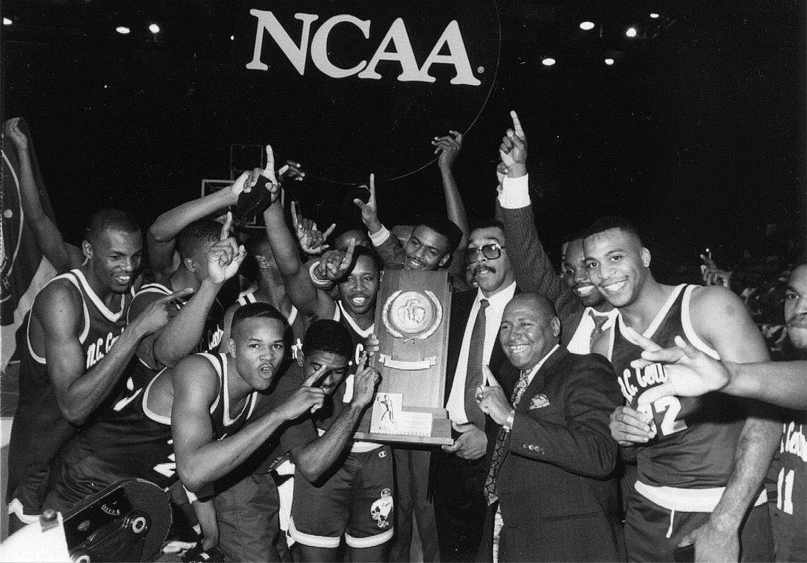 Coach Mike Bernard is surrounded by a happy group of N.C. Central national champions, who will reunite for a 30th anniversary celebration Saturday.