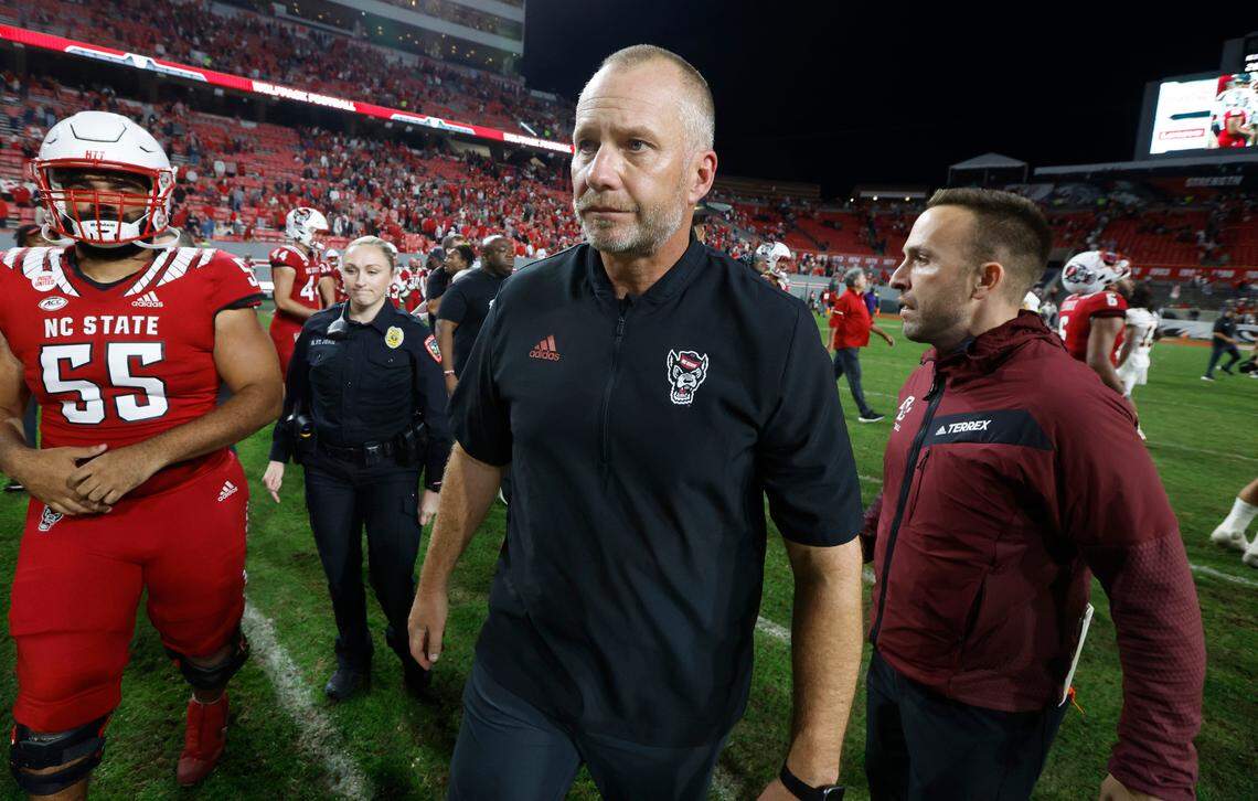 N.C. State head coach Dave Doeren walks towards the tunnel after shaking hands with Boston College head coach Jeff Hafley after Boston College’s 21-20 victory over N.C. State at Carter-Finley Stadium in Raleigh, N.C., Saturday, Nov. 12, 2022.
