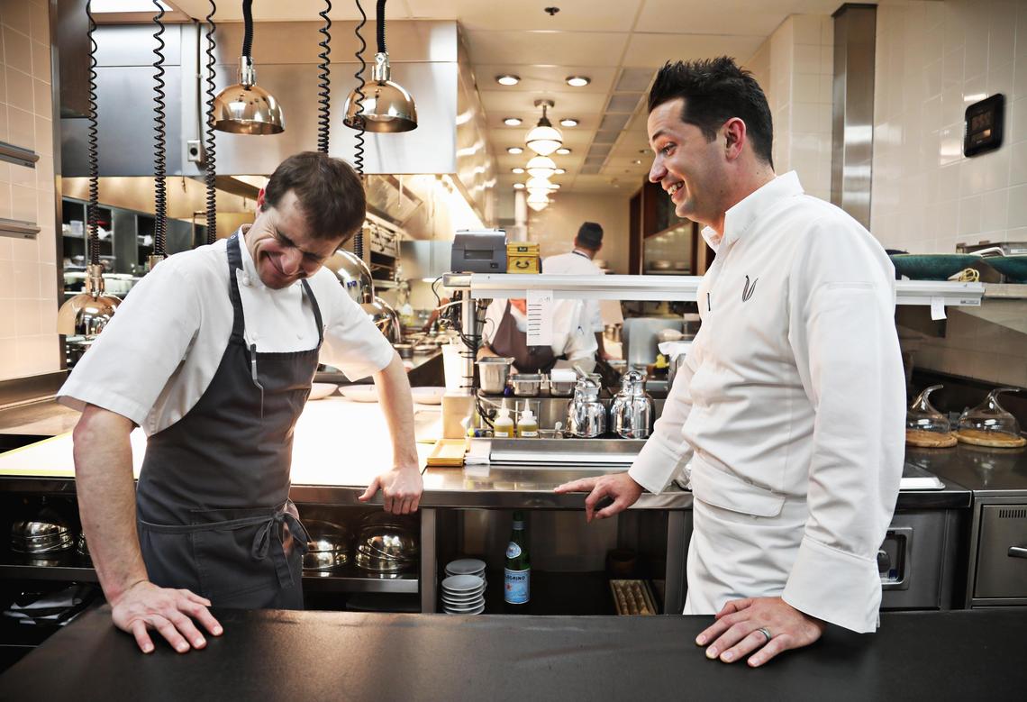 Herons’ chef de cuisine Spencer Thomson, left, laughs with executive chef Steven Devereaux Greene in the Cary restaurant’s kitchen at the start of dinner service on Tuesday, Jan. 18, 2019. Thomson and Greene have worked together for years at various restaurants including Devereaux’s.