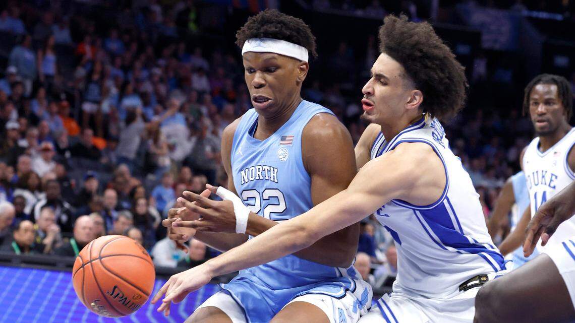 Duke’s Tyrese Proctor (5) tries to steal the ball from North Carolina’s Ven-Allen Lubin (22) during the first half of Duke’s game against UNC in the semifinals of the 2025 ACC Men’s Basketball Tournament at the Spectrum Center in Charlotte, N.C., Friday, March 14, 2025.