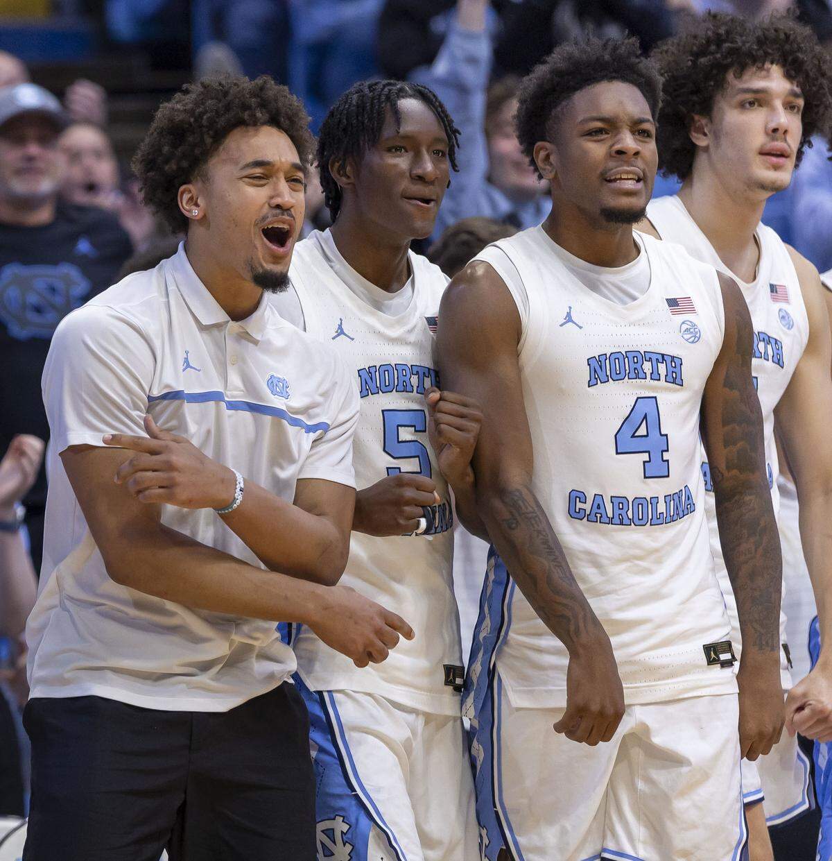 North Carolina guard Seth Trimble and his teammates celebrate after a basket by James Brown (2) in the second half against East Tennessee State on Tuesday, Dec. 16, 2025 at the Smith Center in Chapel Hill, North Carolina.