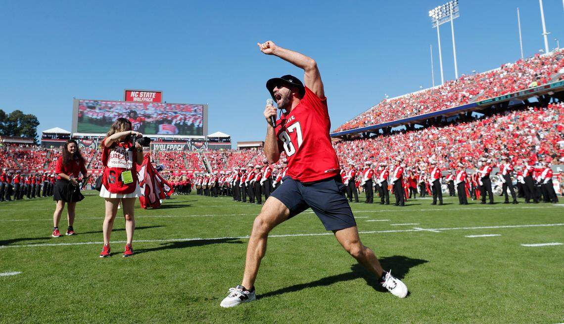 The Carolina Hurricanes’ Jordan Martinook leads a Wolfpack chant before N.C. State’s game against Clemson at Carter-Finley Stadium in Raleigh, N.C., Saturday, Oct. 28, 2023.