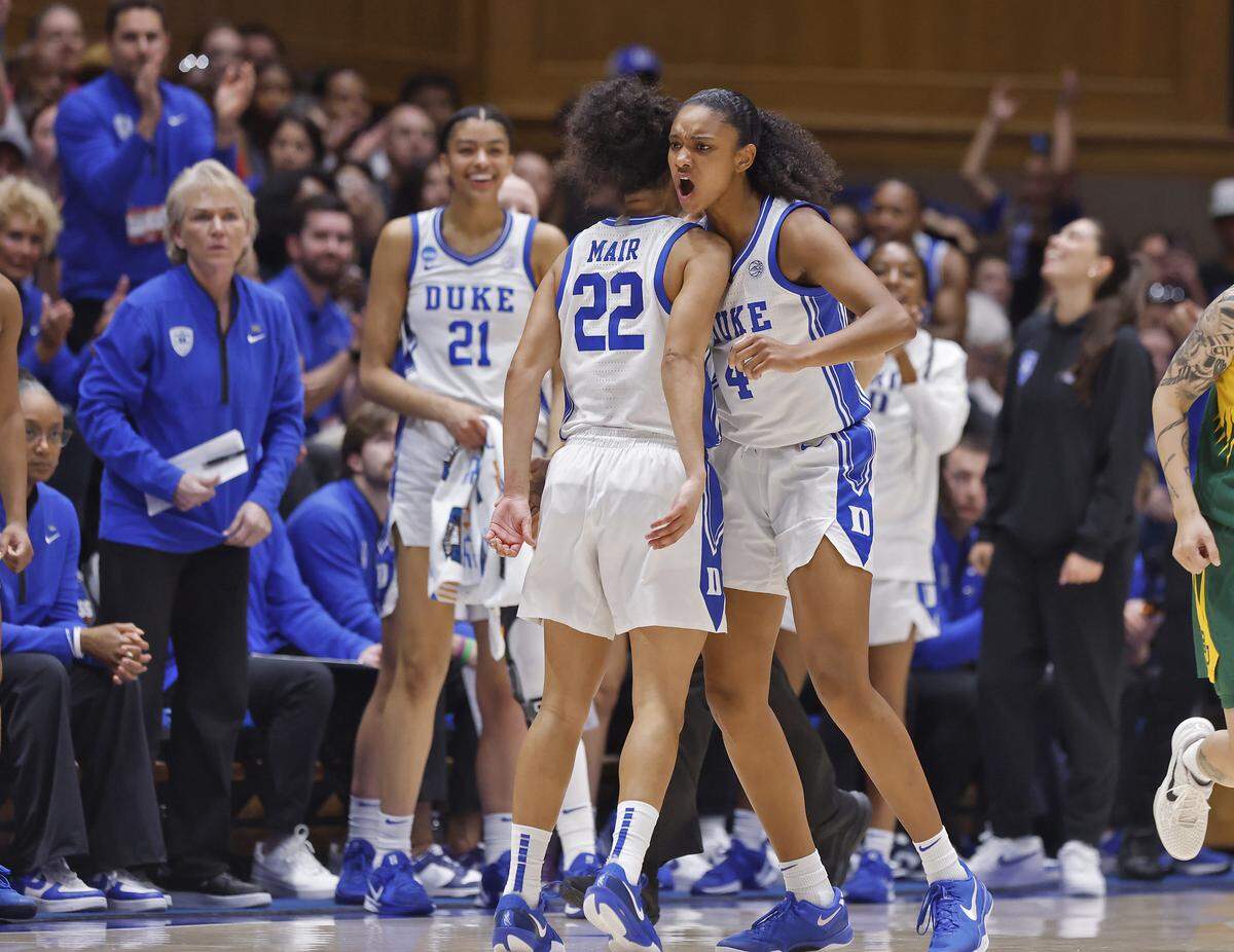 Duke’s Riley Nelson congratulates teammate Taina Mair after a defensive stop during the first half of the Blue Devils’ 69-46 second-round NCAA Tournament win over Baylor on Sunday, March 22, 2026, at Cameron Indoor Stadium in Durham, N.C.