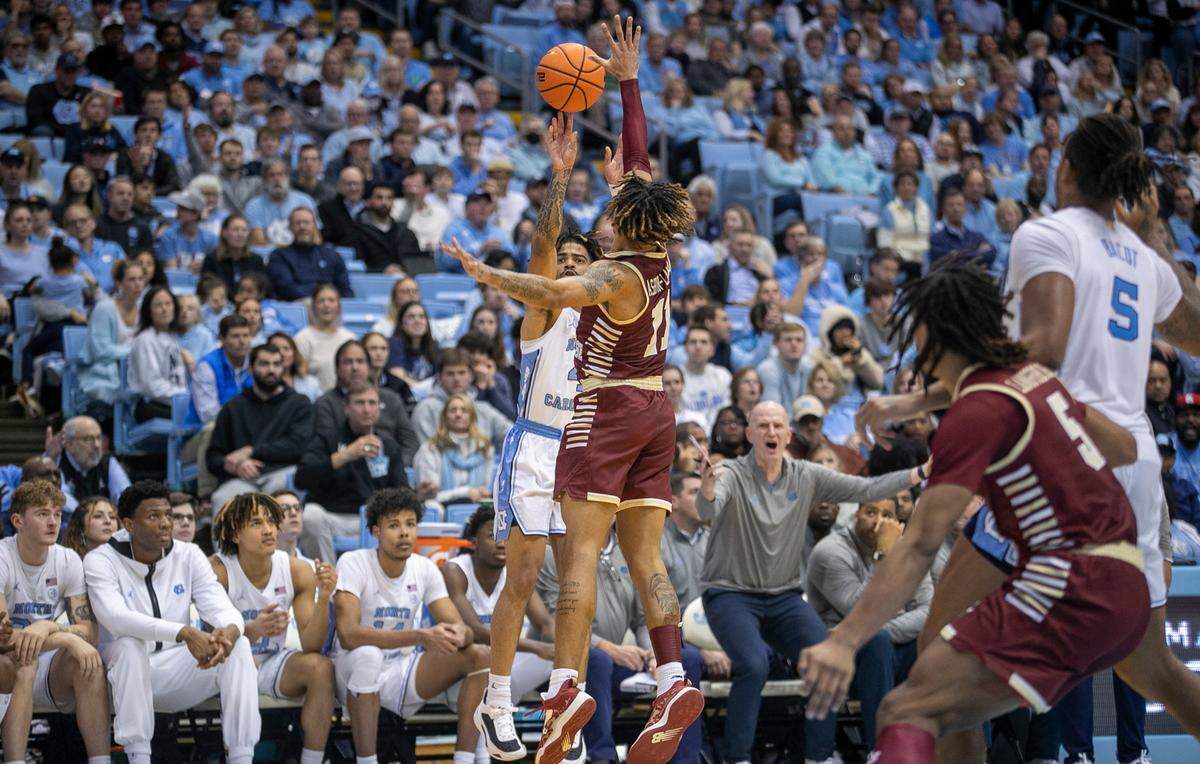North Carolina’s R.J. Davis (4) launches a three-point shot over Boston College’s Makai Ashton-Langford (11) during the second half on Tuesday, January 17, 2023 at the Smith Center in Chapel Hill, N.C.