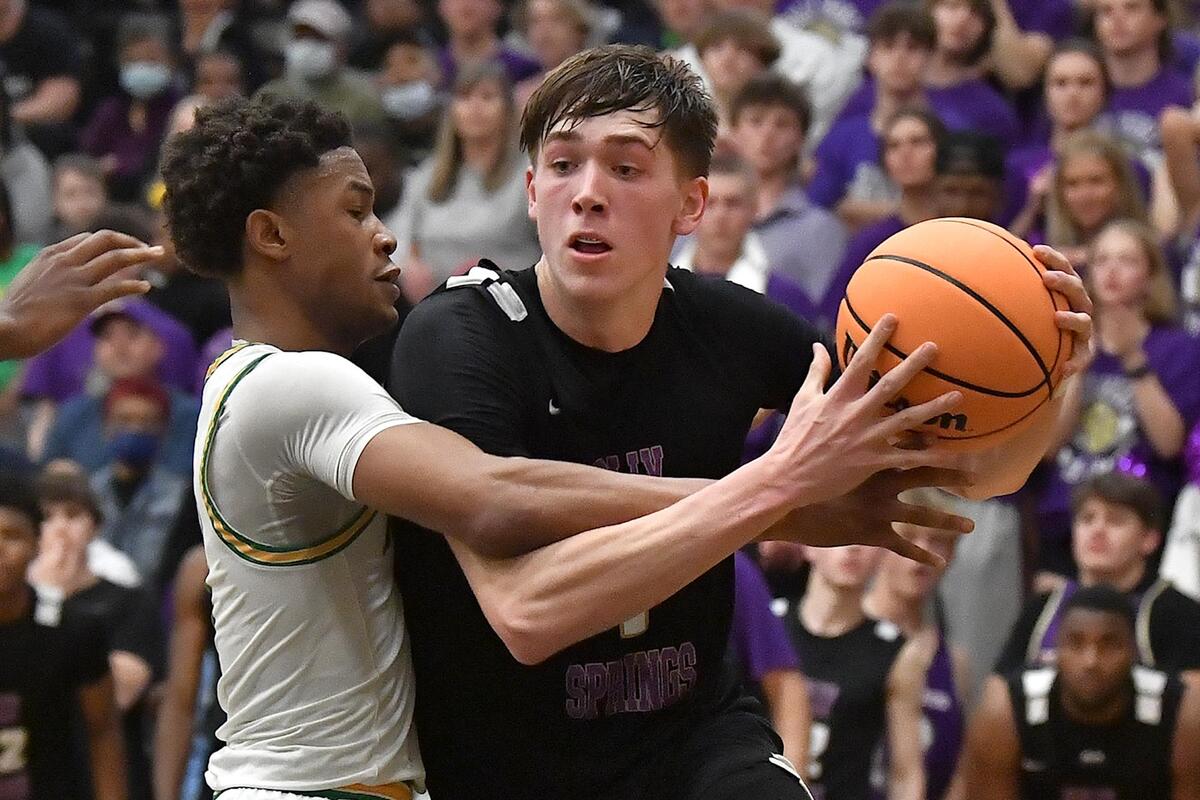 Holly Springs’ Collin Kuhl (1) The Richmond Raiders and the drives against Richmond’s Zion Baldwin (4) during the second half. Holly Springs Golden Hawks met in the NCHSAA 4A East Regional Finals in Sanford, N.C. on March 4, 2023.