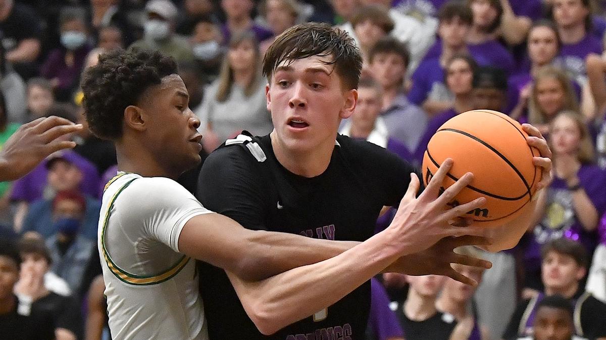 Holly Springs’ Collin Kuhl (1) The Richmond Raiders and the drives against Richmond’s Zion Baldwin (4) during the second half. Holly Springs Golden Hawks met in the NCHSAA 4A East Regional Finals in Sanford, N.C. on March 4, 2023.