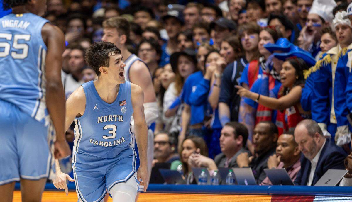 North Carolina’s Cormac Ryan (3) reacts after scoring his second three-point basket in the first half against Duke on Saturday, March 9, 2024 at Cameron Indoor Stadium in Durham, N.C.
