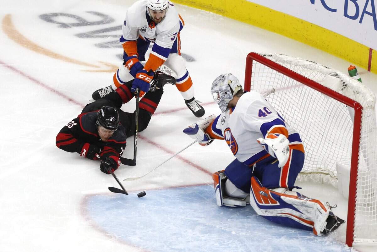 Carolina’s Brock McGinn (23) attempts a shot on New York’s Robin Lehner (40) during the first period of the Carolina Hurricanes’ game against the New York Islanders at PNC Arena in Raleigh Wednesday, May 1, 2019. New York’s Adam Pelech (3) also defends