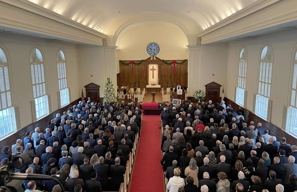 The Rev. Nick Demuynck, pastor of First Presbyterian Church, presides over the funeral service for former North Carolina Gov. Jim Hunt before a packed sanctuary on Friday, Dec. 26, 2025, in Wilson.