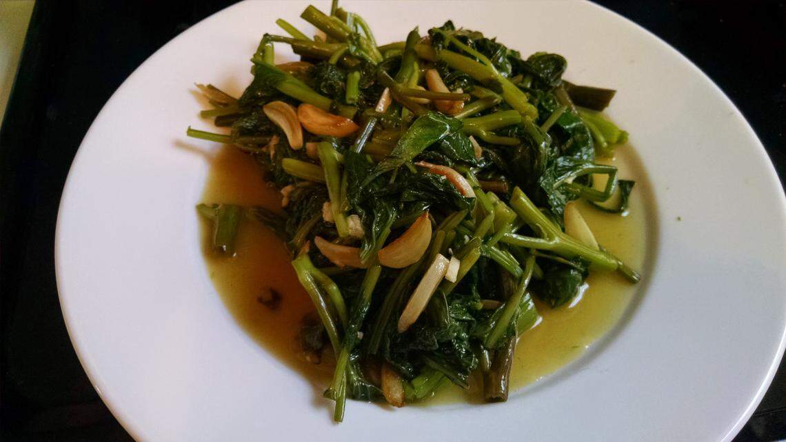 Garlicky greens can be the center of your meal- eat with a grain and a fried egg, or gobble them up on their own.  This is rau muong, also known as ong choy or morning glory, dressed with a mix of lime juice, fish sauce and sugar.  More commonly I eat garlicky kale dressed with balsamic vinegar.