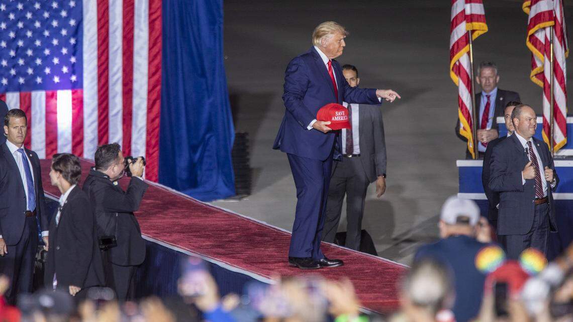 Former President Donald Trump takes the stage during a rally at Wilmington International Airport Friday, Sept. 23, 2022.
