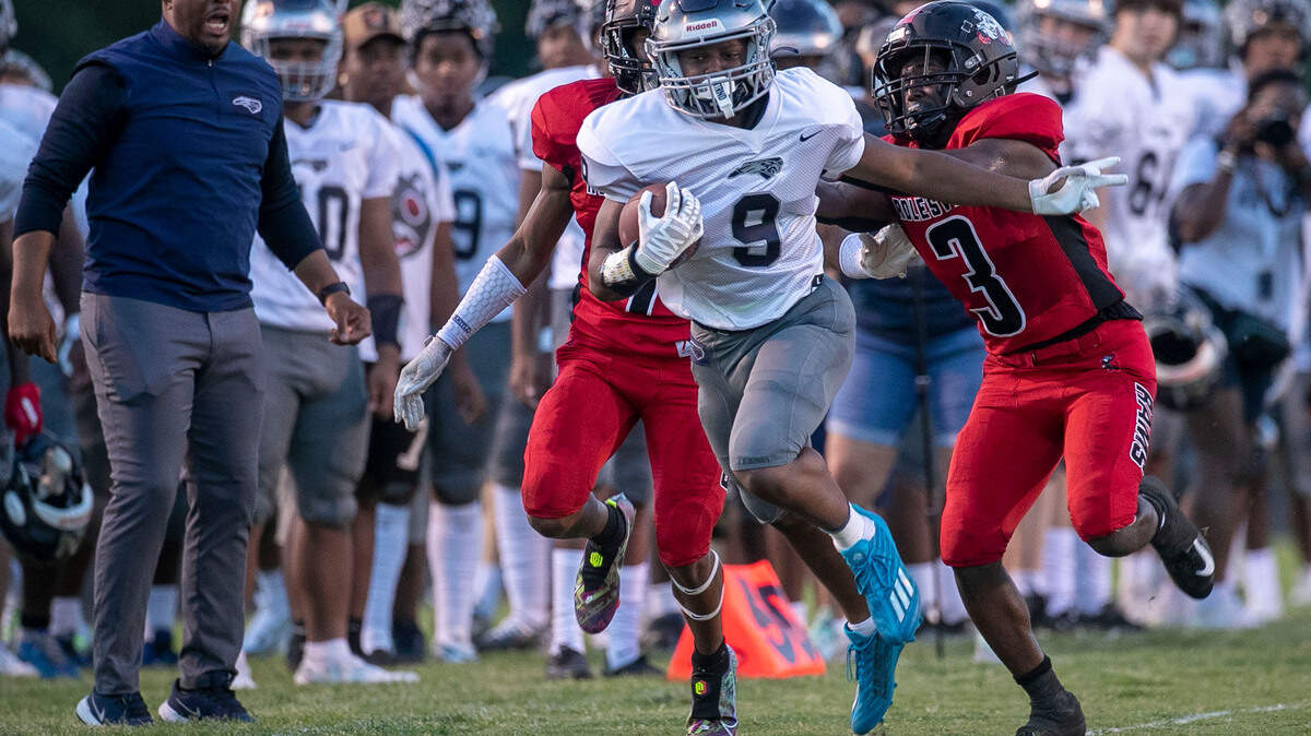 East Forsyth’s Lawrence Riggs III (9) breaks open for a long run in the first quarter ahead of Rolesville’s Reggie Love (3) on Friday, August 26. 2022 at Rolesville High School in Rolesville, N.C.