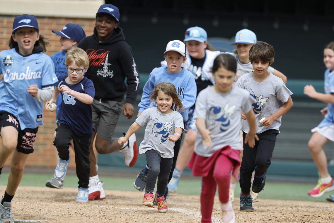 Kids run the bases after North Carolina’s game against Georgia Tech at Boshamer Stadium in Chapel Hill, N.C., Sunday, April 19, 2026.