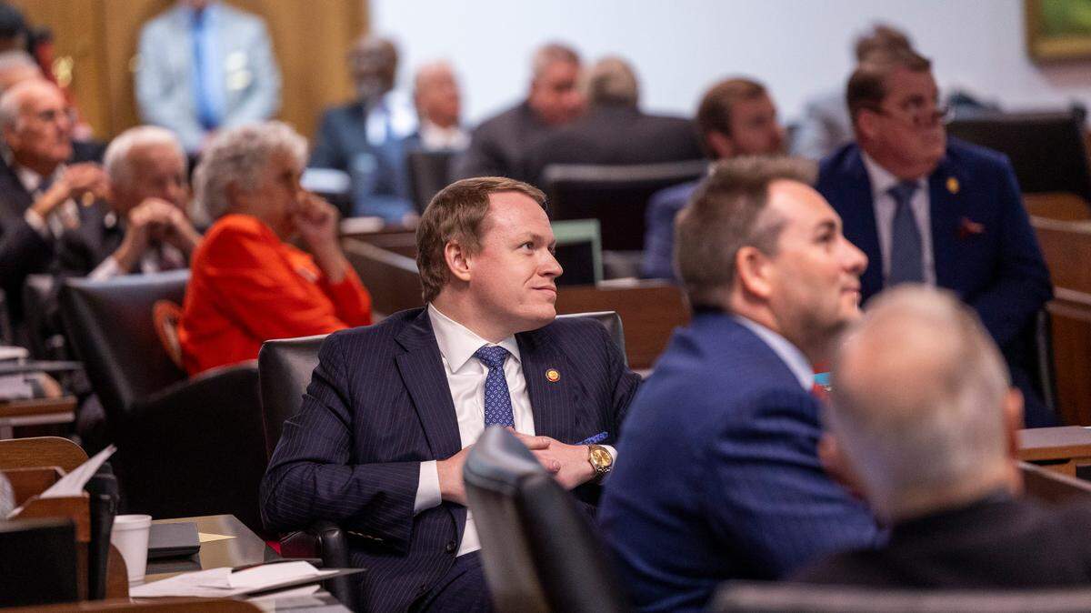 Lawmakers, including Republican Rep. Destin Hall, who represents Caldwell and Watauga counties, center, watch as police remove demonstrators from the House gallery after a vote to override Gov. Roy Cooper’s veto of a bill that reduces the power of incoming Democrats in the executive branch during a session on Wednesday, Dec. 11, 2024, at the North Carolina Legislative Building. Cooper vetoed Senate Bill 382 on Nov. 26, calling it “a sham” and criticizing it for lacking hurricane relief and including various power grabs.
