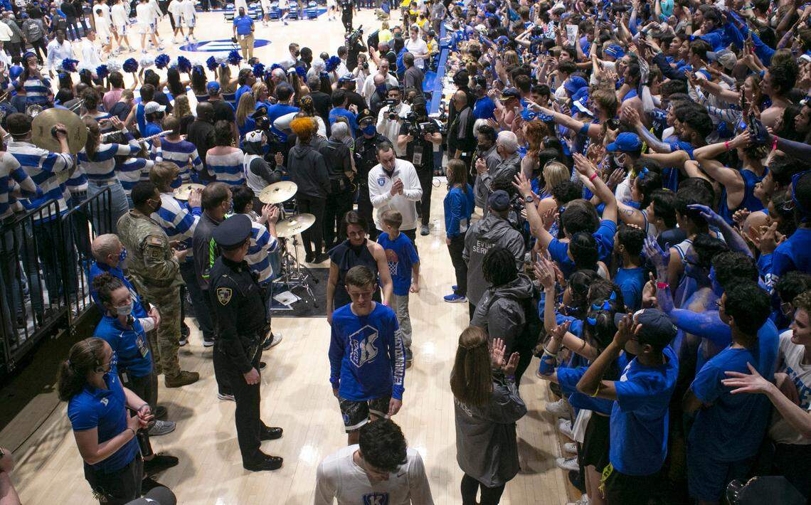 Duke head coach Mike Krzyzewski acknowledges the crowd as he walks off the court for the final time after a post game ceremony after the Blue Devils’ game against North Carolina at Cameron Indoor Stadium in Durham, N.C., Saturday, March 5, 2022.