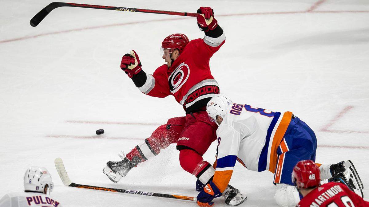 The Carolina Hurricanes Jesper Fast (71) collides with the New York Islanders Noah Dobson (8) in the third period during Game 2 of their Stanley Cup series on Wednesday, April 19, 2023 at PNC Arena in Raleigh, N.C.