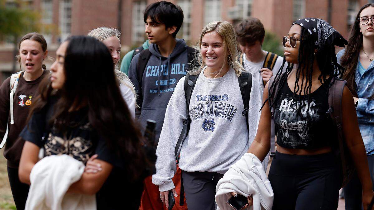 People walk through the campus of University of North Carolina at Chapel Hill on Oct. 31, 2022. 