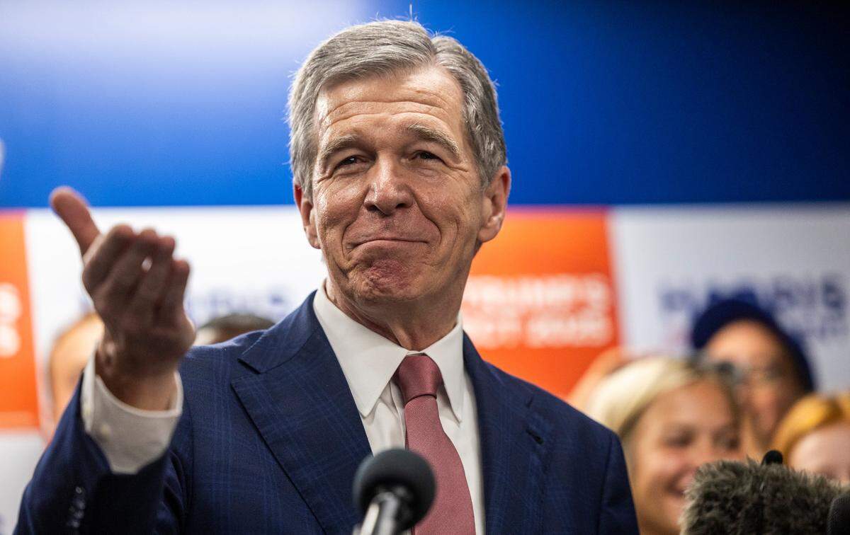 Gov. Roy Cooper answers questions from reporters during a Harris campaign event in Raleigh on Thursday, July 25, 2024. Cooper is on Vice President Kamala Harris’ short list of potential running mates.