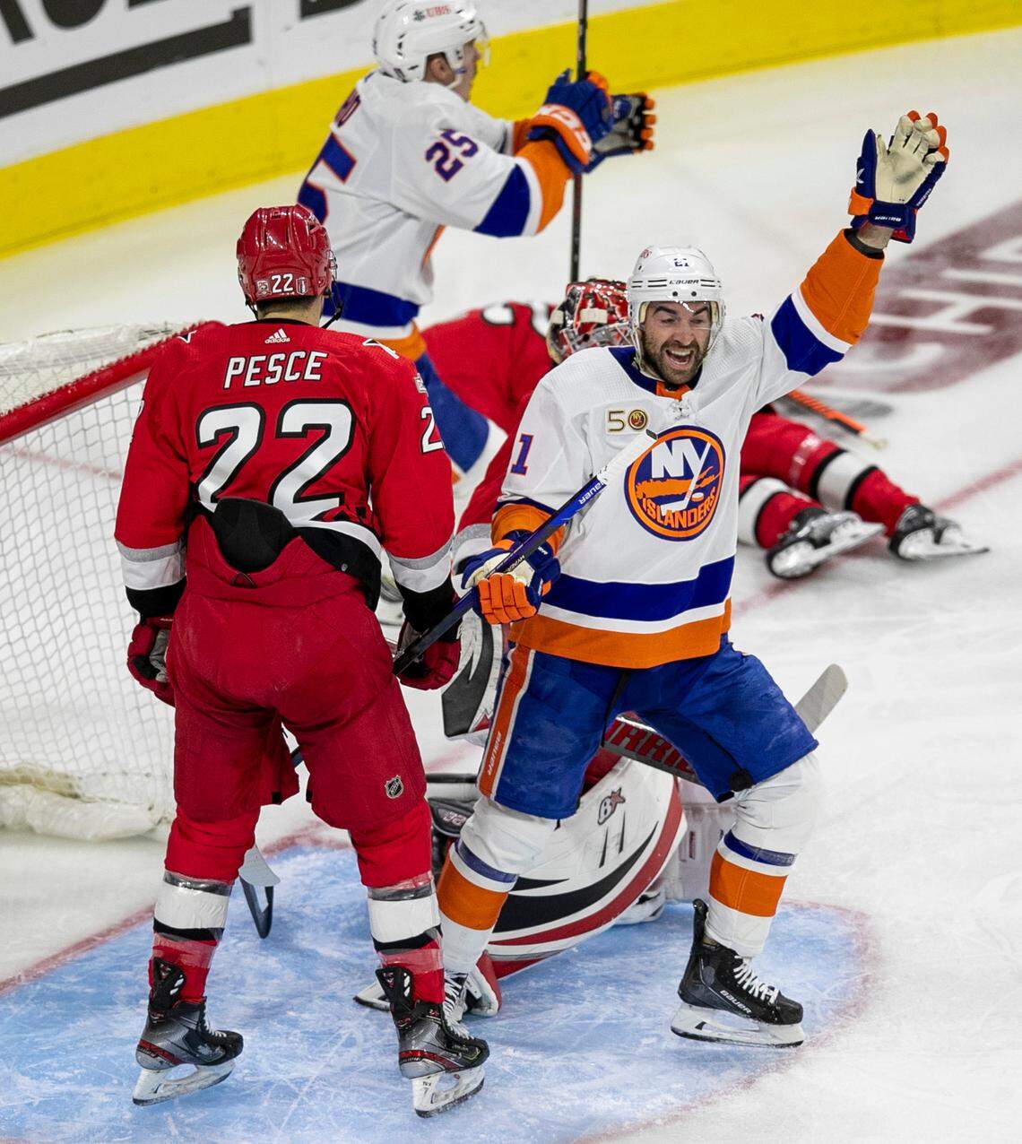 The New York Islanders Kyle Palmeri (21) reacts after a goal buy teammate Brock Nelson (29) to give the Islanders a 2-0 lead over the Carolina Hurricanes in the second period during Game 5 of their Stanley Cup series on Tuesday, April 25, 2023 at PNC Arena in Raleigh, N.C.