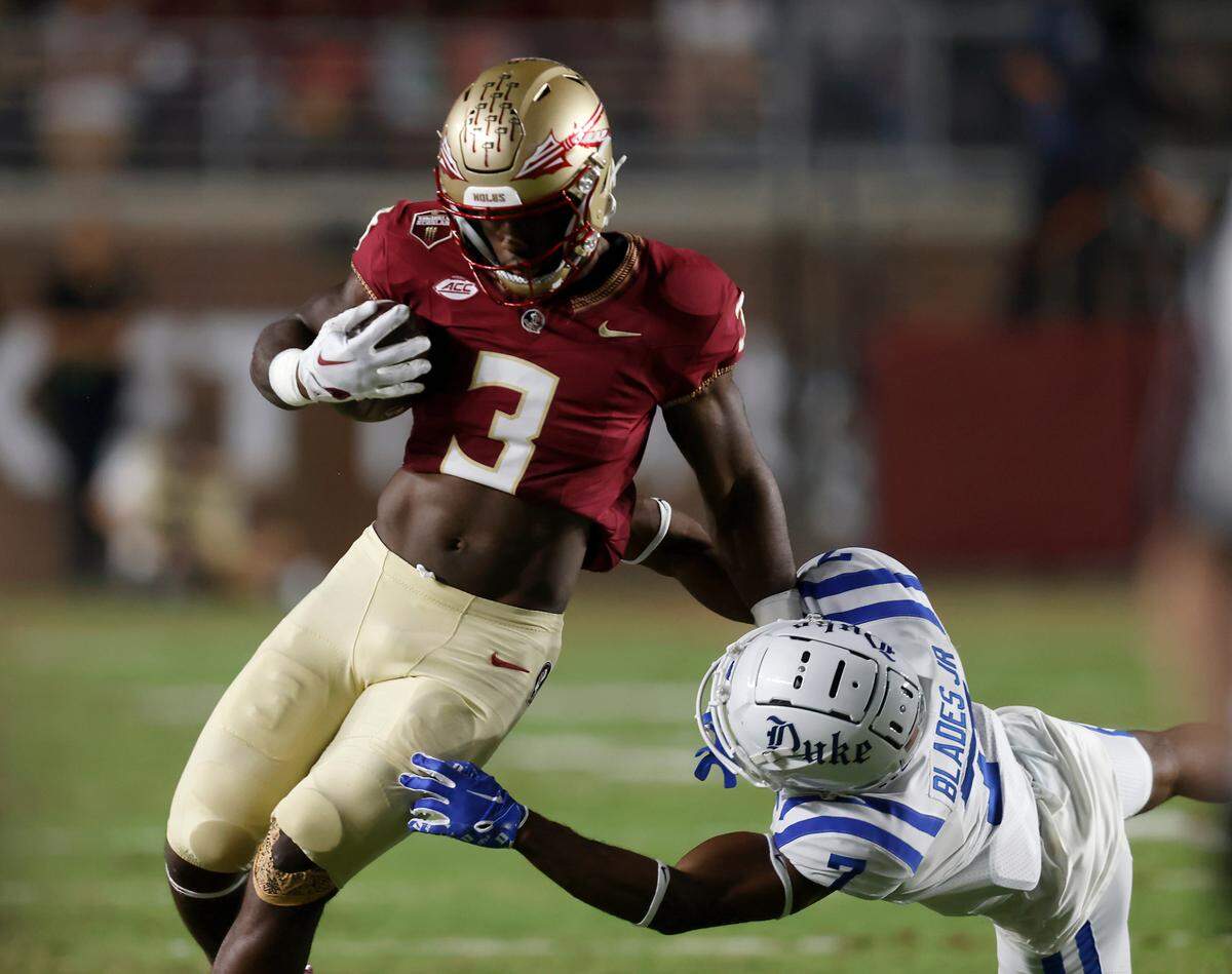 Florida State’s Trey Benson runs the ball past Duke’s Al Blades Jr. during the first half of the Blue Devils’ 38-20 loss on Saturday, Oct. 21, 2023, in Tallahassee, Fla.
