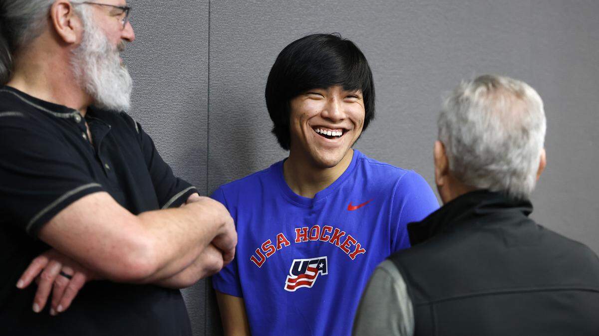 Kayden Beasley laughs with his father Anthony, left, and grandfather Judson Parrish after participating in a press conference at the Lenovo Center on Feb. 24, 2026. Beasley is a member of the U.S. National Sled Hockey Team who are competing in the 2026 Paralympic Winter Games in Italy.