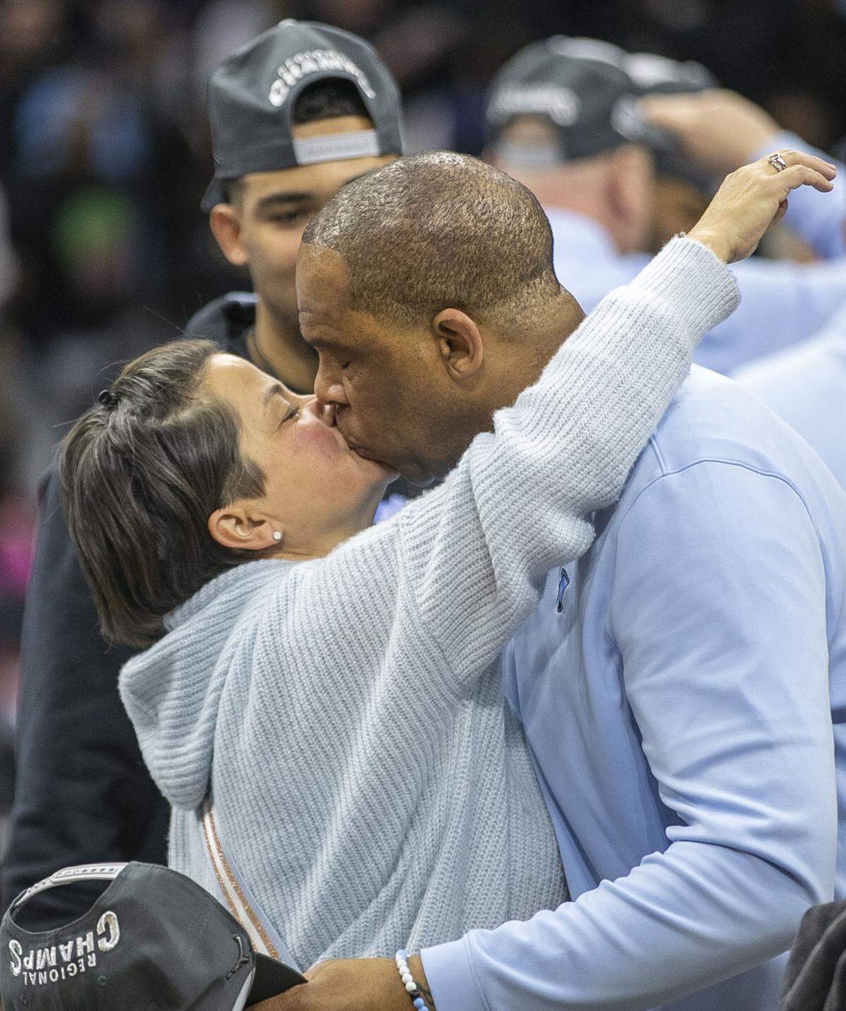 North Carolina coach Hubert Davis kisses his wife Leslie as they celebrate the Tar Heels’ victory over Saint Peter’s in the NCAA East Regional final on Sunday, March 27, 2022 at Wells Fargo Center in Philadelphia, Pa.
