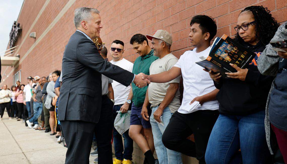 North Carolina Gov. Josh Stein greets Jonathon Curiel during a visit to the Raleigh East Driver License Office Friday, May, 30, 2025. Curiel was waiting to take his driving test.