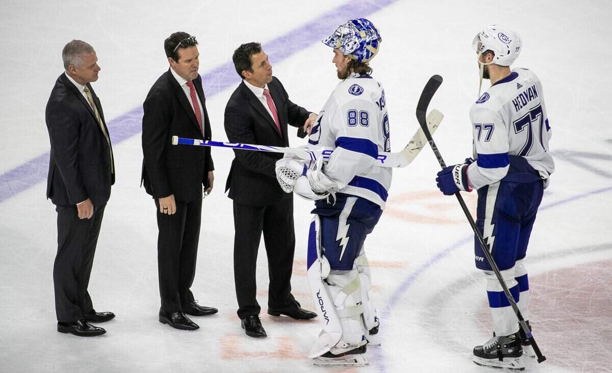 Carolina Hurricanes coach Rod BrindAmour shakes hands with Tampa Bay goalie Andrei Vasilevskiy (88) after the Lightning clinched their series against the Hurricanes with a 2-0 victory in game five on Tuesday, June 8, 2021 at PNC Arena in Raleigh, N.C.