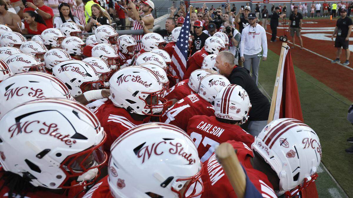 N.C. State head coach Dave Doeren prepares to lead the team onto the field before the Wolfpack’s game against ECU at Carter-Finley Stadium in Raleigh, N.C., Thursday, August 28, 2025.