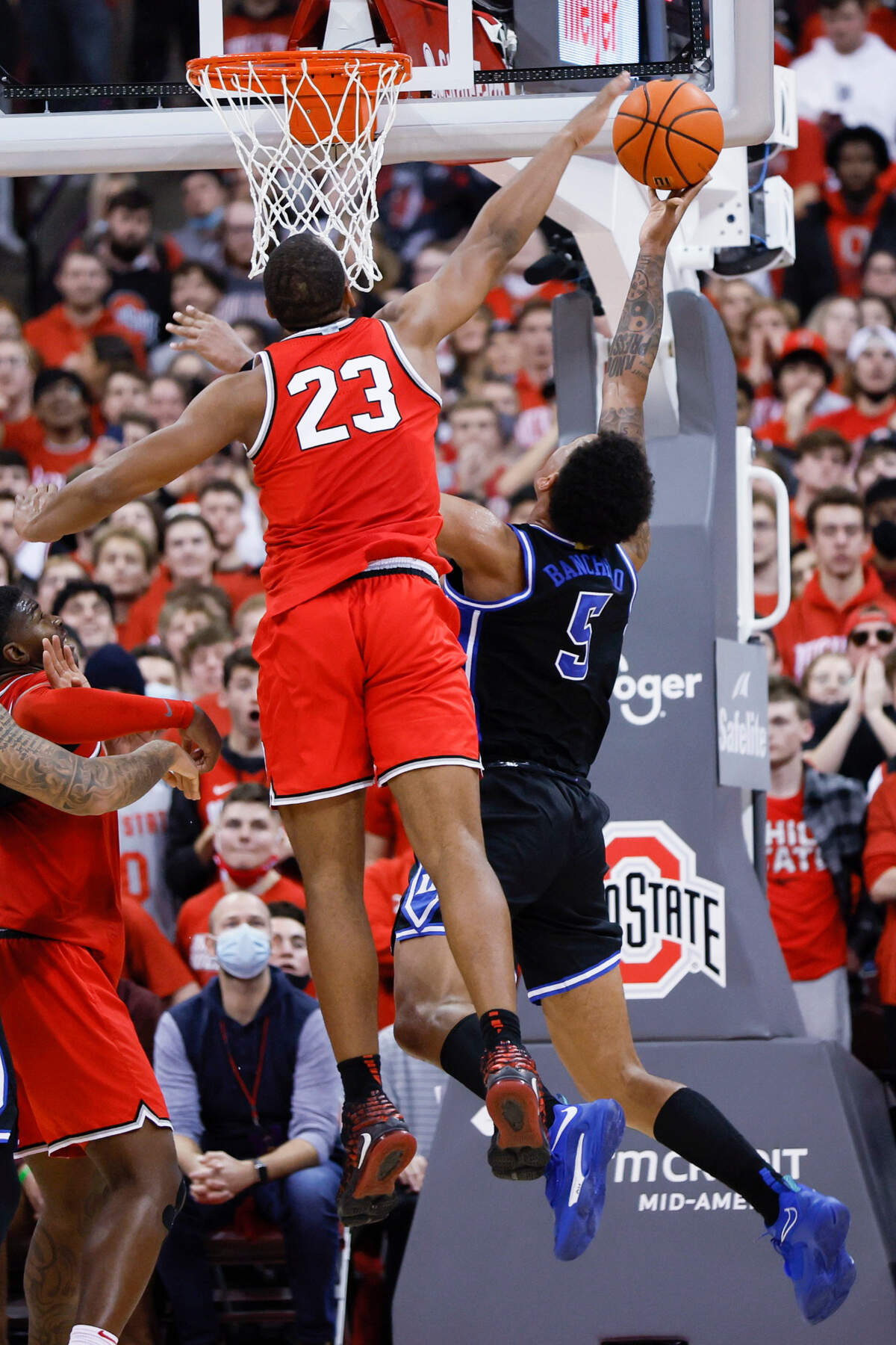 Ohio State’s Zed Key, left, blocks the shot of Duke’s Paolo Banchero during the second half of an NCAA college basketball game Tuesday, Nov. 30, 2021, in Columbus, Ohio.
