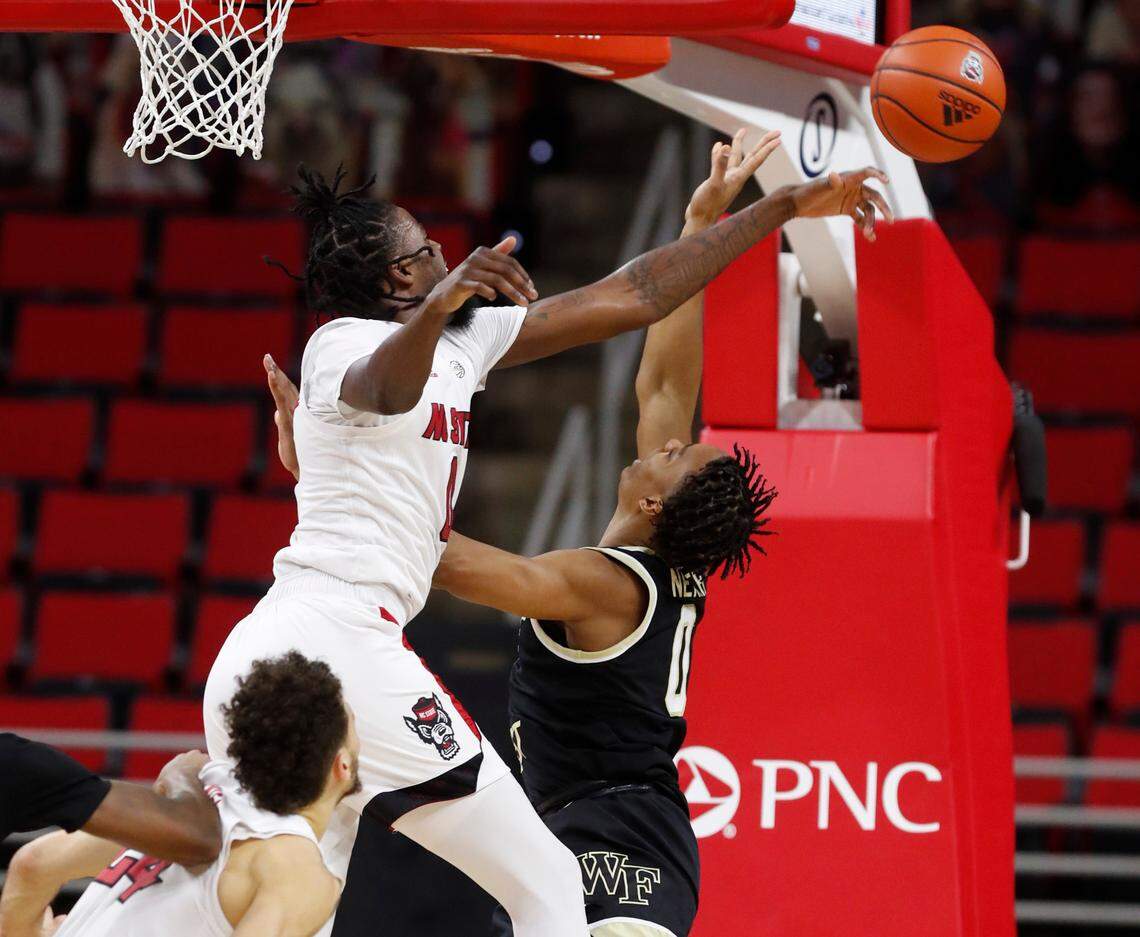N.C. State’s D.J. Funderburk (0) blocks the shot by Wake Forest’s Jahcobi Neath (0) during the first half of N.C. State’s game against Wake Forest at PNC Arena in Raleigh, N.C., Wednesday, January 27, 2021.