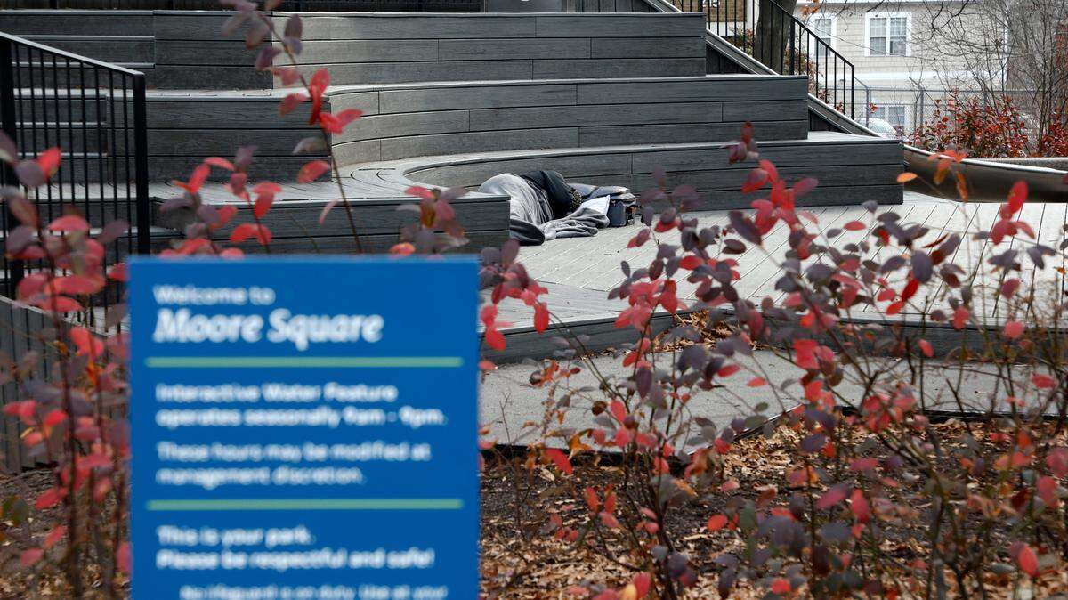 A person sleeps in Moore Square in Raleigh, N.C., photographed Thursday, Jan. 19, 2023.