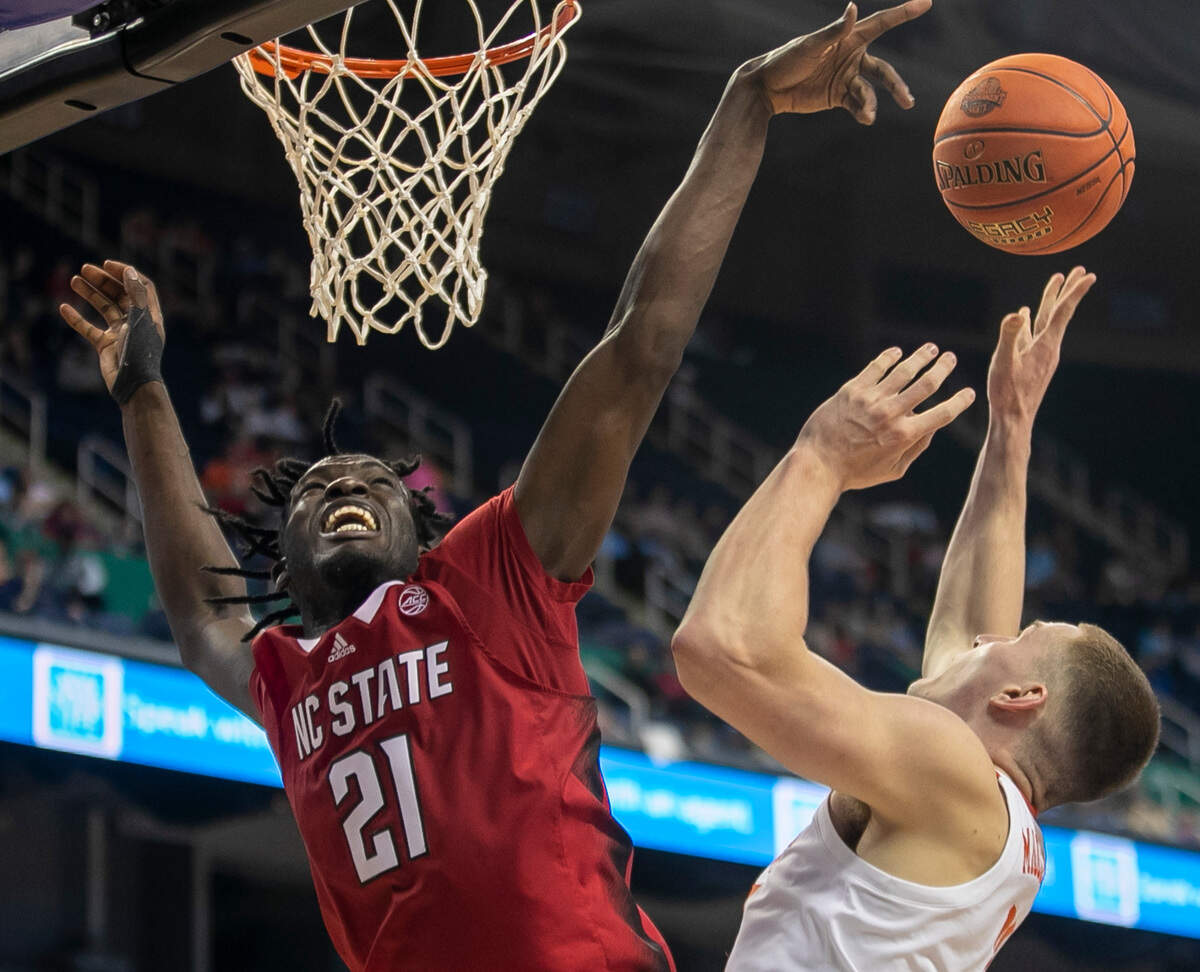 N.C. State’s Ebenezer Dowuona (21) blocks a shot by Clemson’s Ben Middlebrooks (10) in the second half during the third round of the ACC Tournament on Thursday, March 9, 2023 at the Greensboro Coliseum in Greensboro, N.C.
