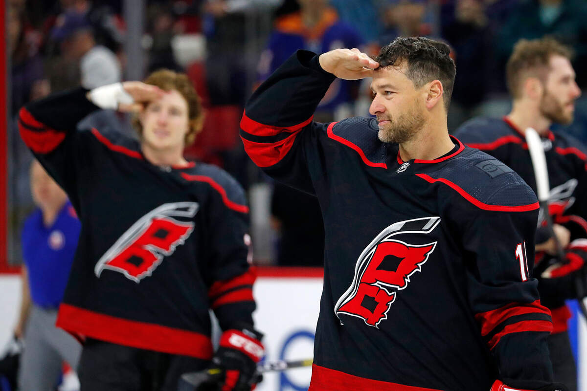 Carolina Hurricanes’ Justin Williams (14) participates in the post game celebration following the Hurricanes 2-1 win over the New York Islanders on Military Appreciation Day at PNC Arena in Raleigh, N.C., Sunday, Jan. 19, 2020. (AP Photo/Karl B DeBlaker)
