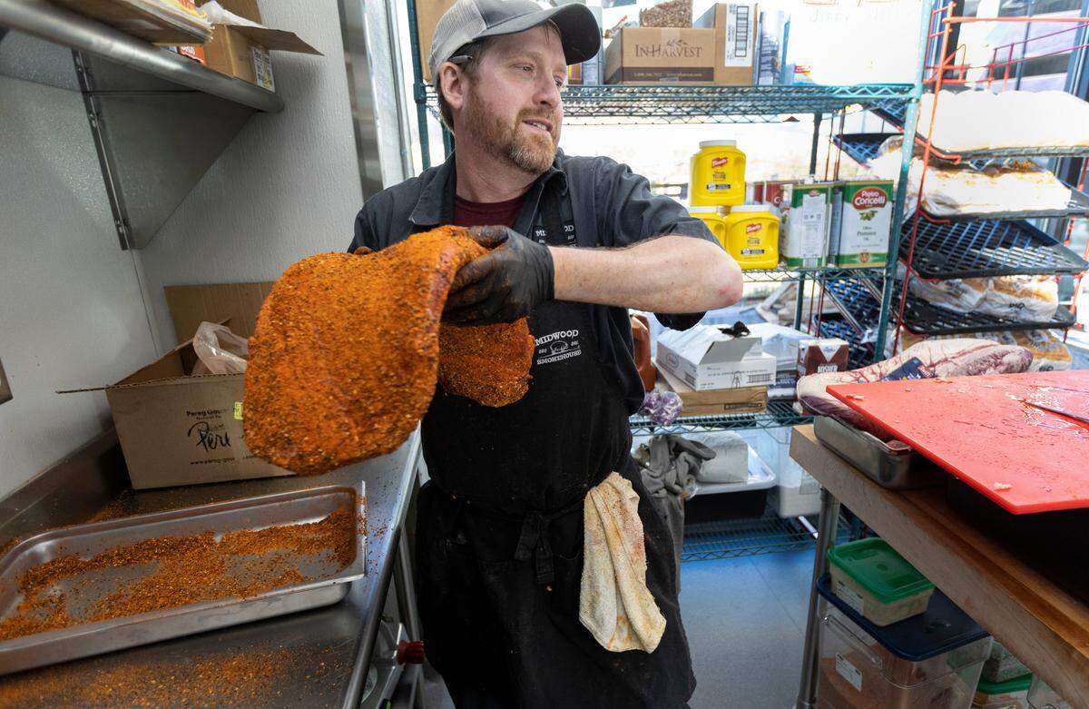 Pitmaster Matt Barry prepares brisket at Midwood Smokehouse in Raleigh, N.C., Wednesday, Feb. 8, 2023.