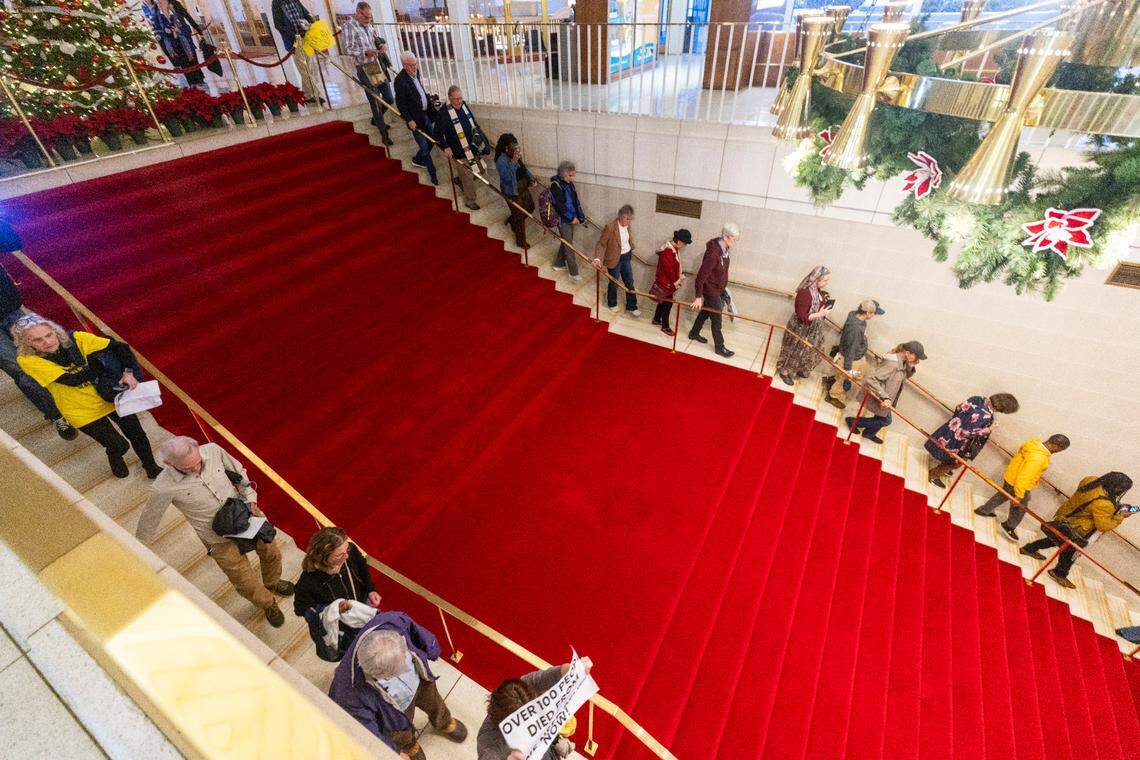 Demonstrators chant while leaving the North Carolina Legislative Building after the House voted to override Gov. Roy Cooper’s veto of a Helene relief bill that reduces the power of incoming Democrats in the executive branch during a session on Wednesday, Dec. 11, 2024. Cooper vetoed Senate Bill 382 on Nov. 26, calling it “a sham” and criticizing it for lacking hurricane relief and including various power grabs.