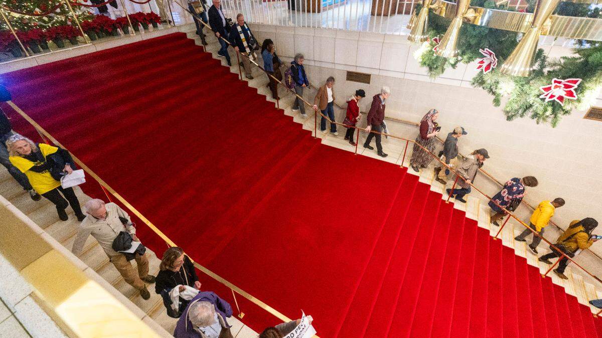 Demonstrators chant while leaving the North Carolina Legislative Building after the House voted to override Gov. Roy Cooper’s veto of a Helene relief bill that reduces the power of incoming Democrats in the executive branch during a session on Wednesday, Dec. 11, 2024. Cooper vetoed Senate Bill 382 on Nov. 26, calling it “a sham” and criticizing it for lacking hurricane relief and including various power grabs.