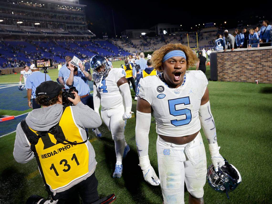 North Carolina Tar Heels defensive lineman Jahvaree Ritzie celebrates while exiting Wallace Wade Stadium after the Tar Heels defeated Duke 38-35 on Saturday, Oct. 15, 2022, in Durham, N.C.