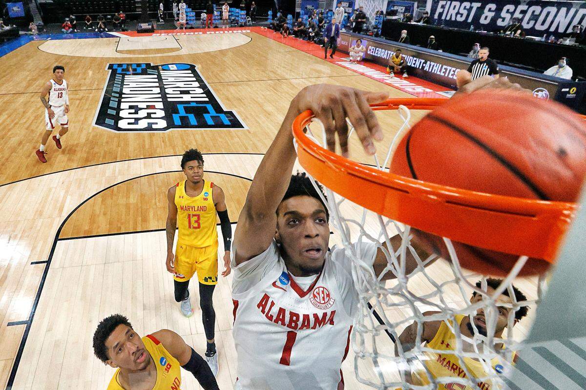 Herbert Jones #1 of the Alabama Crimson Tide dunks in the first half against the Maryland Terrapins in the second round game of the 2021 NCAA Men’s Basketball Tournament at Bankers Life Fieldhouse on March 22, 2021 in Indianapolis, Indiana. 