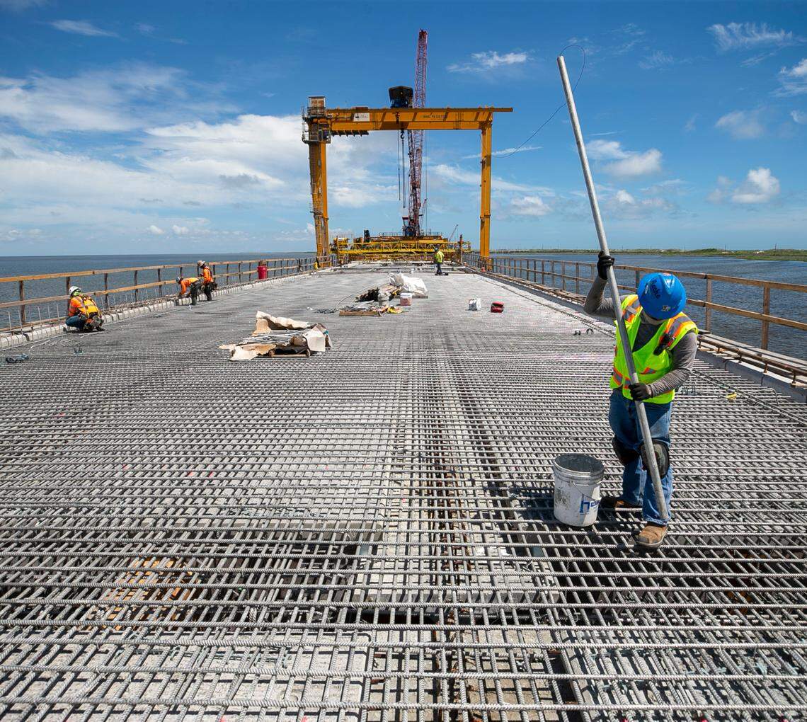 A construction worker on the Jug Handle Bridge on Wednesday, June 30, 2021 in Rodanthe, N.C. The bridge is being built over the Pamlico Sound away from the beach front near an area called the ‘S Curves’, one of the hot spots along NC 12 that is often subjected to erosion and flooding during storms. The new bridge opened July 28, 2022.