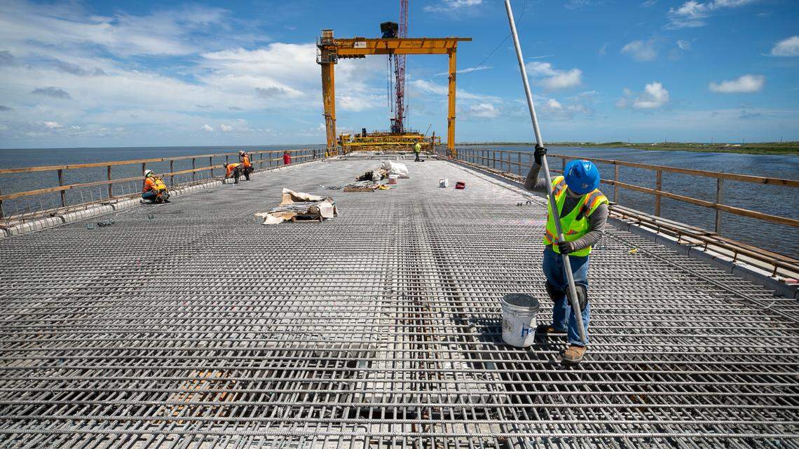 A construction worker on the Rodanthe Bridge on June 30, 2021 while it was being built in Rodanthe, N.C. The 2.4 mile long bridge over the Pamlico Sound took four years to build and opened in July 2022.