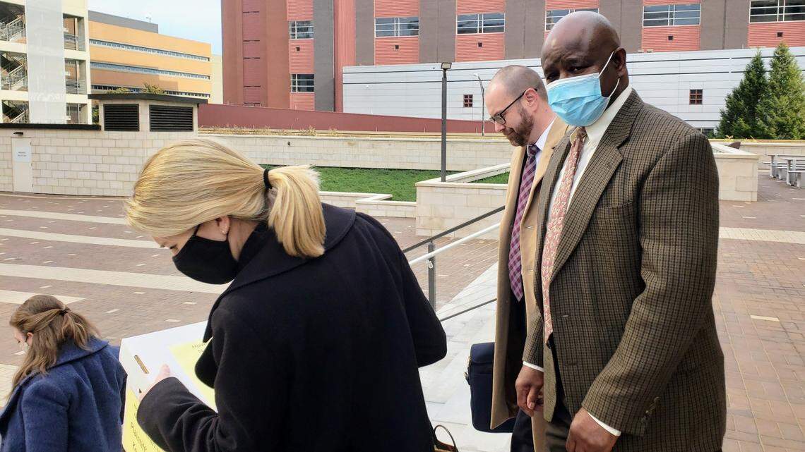 Retired Durham Police Detective Darrell Dowdy walks out of the courtroom on Dec. 1, 2021 with his attorneys after a federal jury found he fabricated evidence and performed an inadequate investigation into a 1991 double murder that resulted in Darryl Howard spending 23 years in behind bars