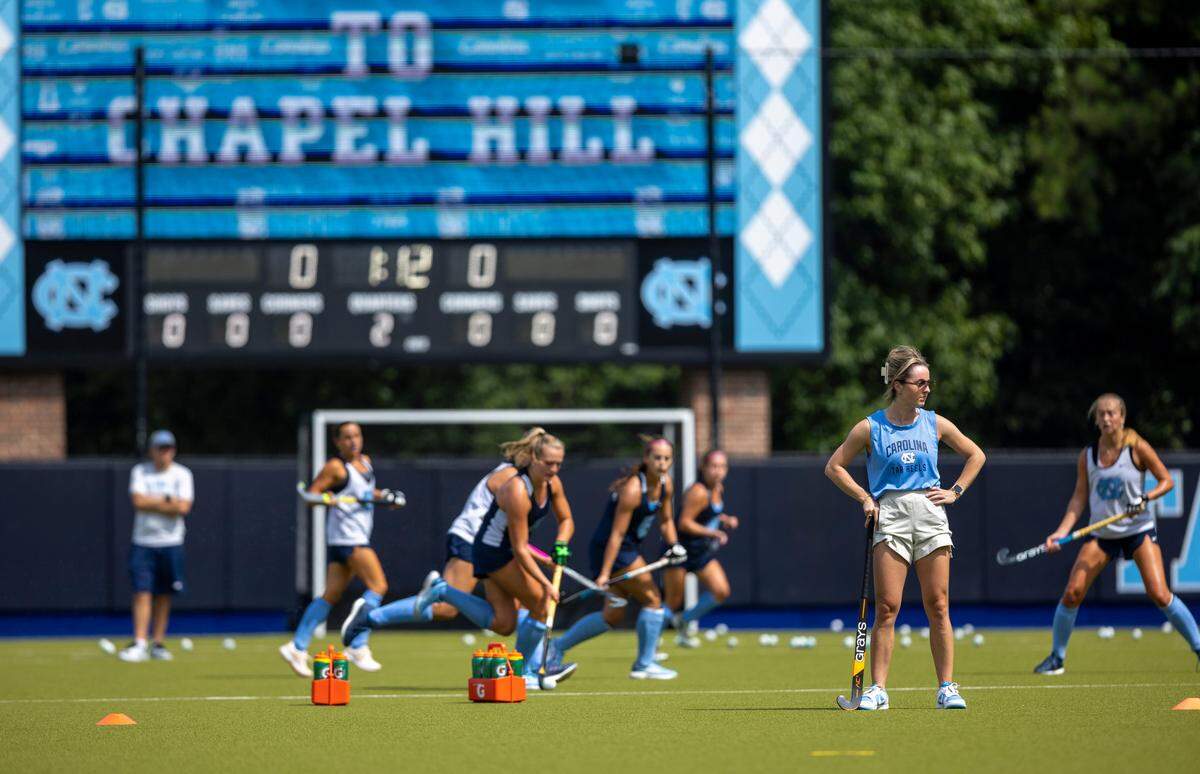 North Carolina field hockey coach Erin Matson watches her team during their first practice of the season on Wednesday August 9, 2023 at Karen Shelton Stadium in Chapel Hill, N.C. Matson, a four time National Champion playing at North Carolina, became the head coach in January, 2023 replacing coach Karen Shelton, who retired.