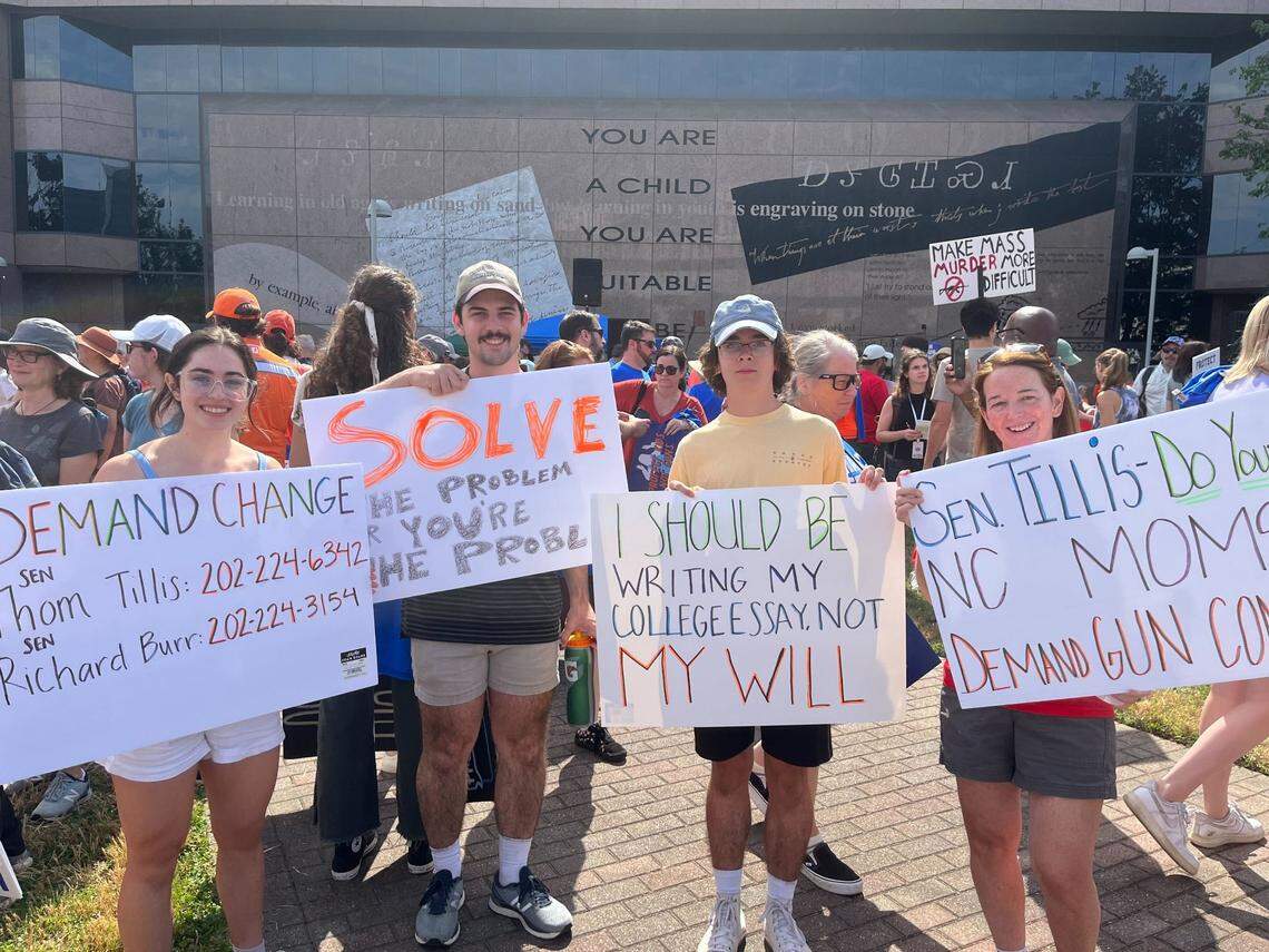 From left to right: Anna, Patrick, Tommy and Katie Dunn, from Cary, hold their signs that they brought to the March for Our Lives in Raleigh. The local rally was one of hundreds that took place Saturday, June 11, in reponse to recent mass shootings in the U.S.